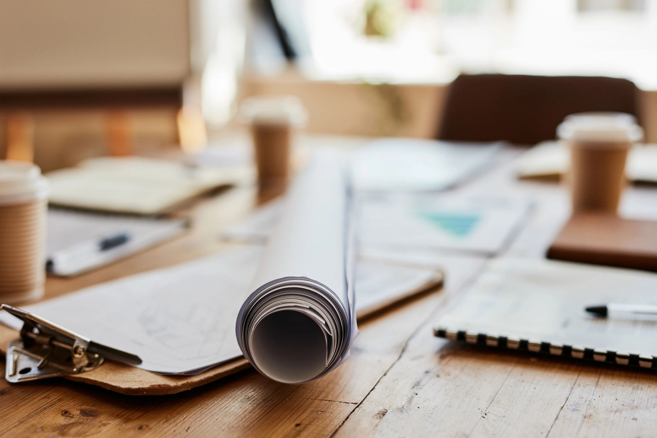 Planning documents and blueprint on a desk