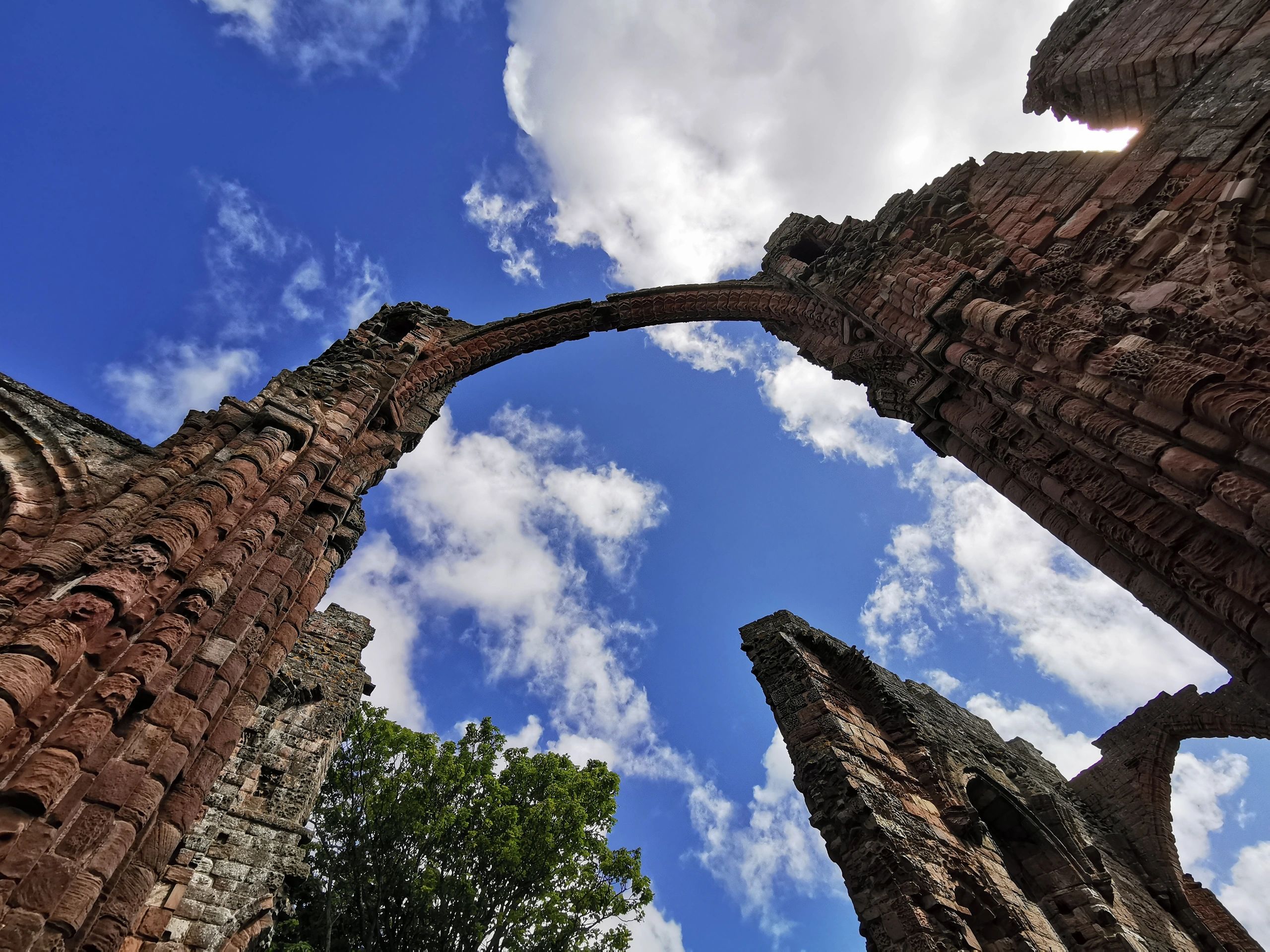 Ruined stone abbey in Northumberland, showing historic architecture