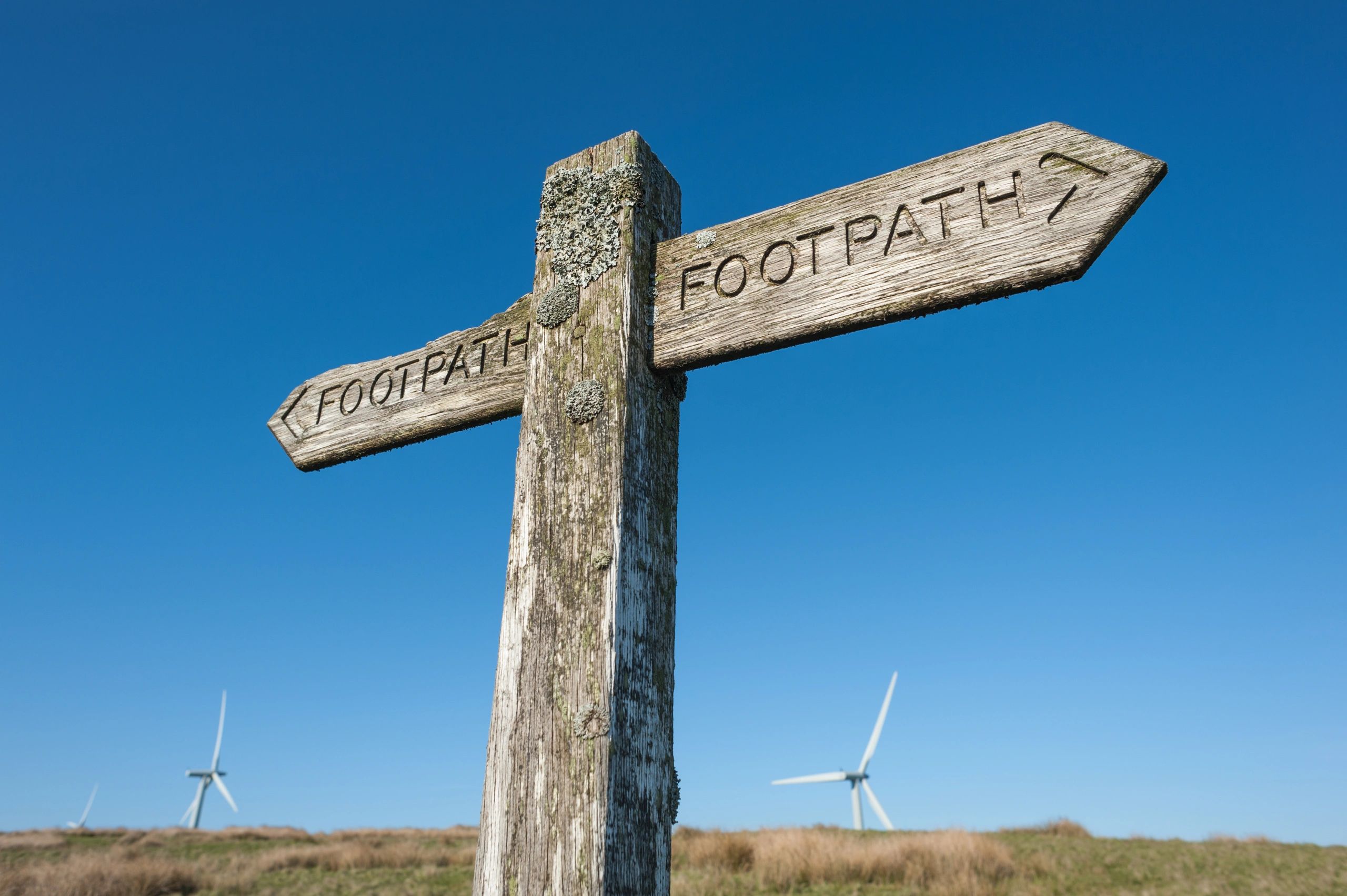 Public footpath sign, representing rights of way and access