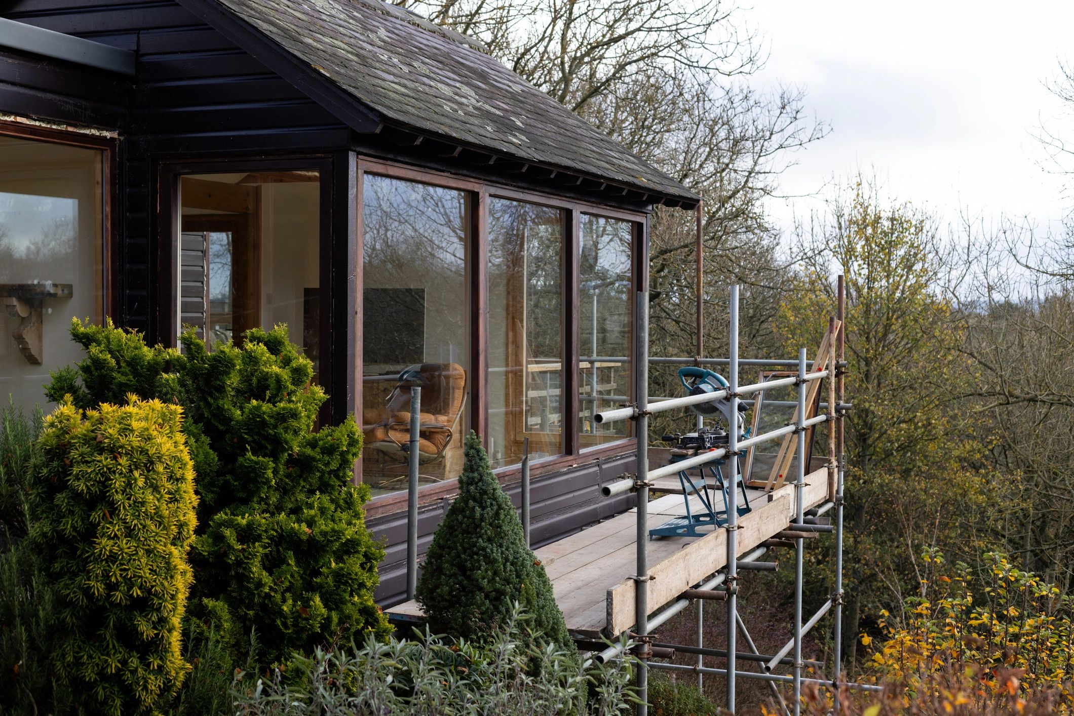 Stone house in Northumberland with scaffolding during building work