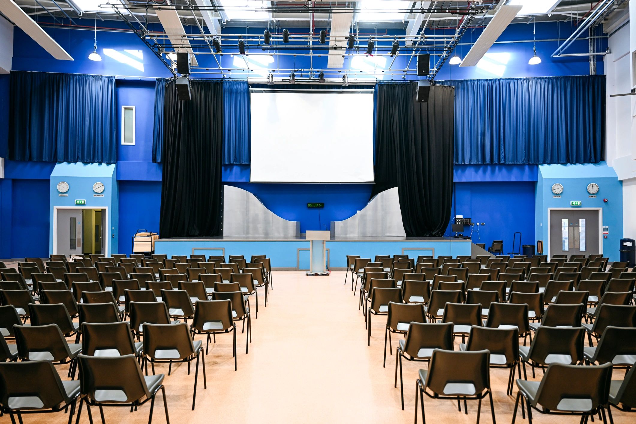 Empty community meeting hall set up for a council meeting